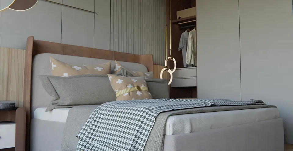Bedroom with a grey upholstered bed, houndstooth throw, patterned cushions and an open wardrobe with hanging clothes.