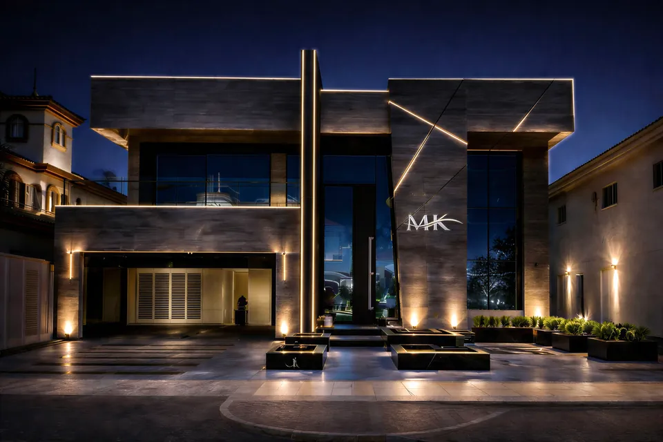 MK Villa, Palm Jumeirah: modern villa facade at night with grey panelled walls, lit vertical lines and MK lettering.