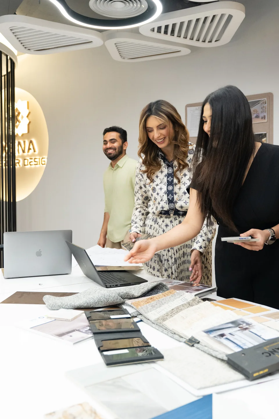 Anita Surani and the design team around the sample table at the Xena studio